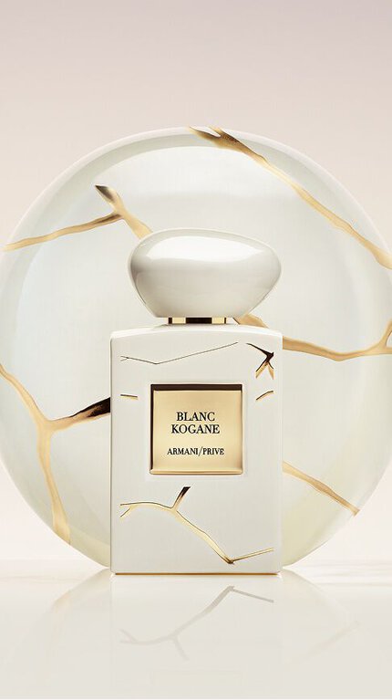 Bottle of Armani/Prive Blanc Kogane against a light beige and white background.