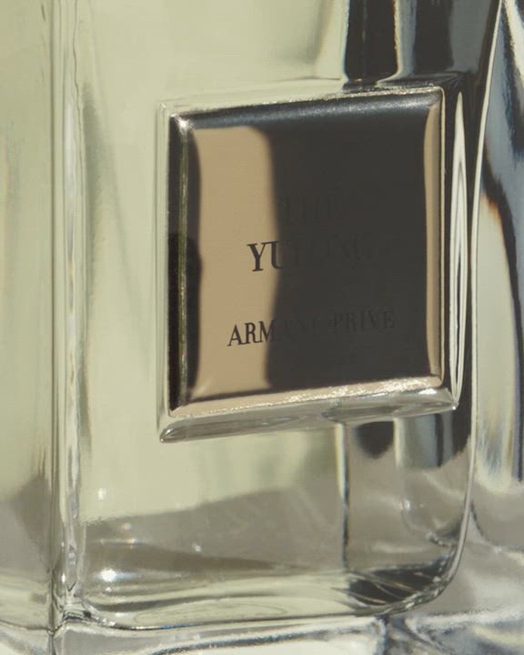 Display of Armani/Prive Les Eaux collection movie with different fragrances and ingredients in a cinematic setting.
