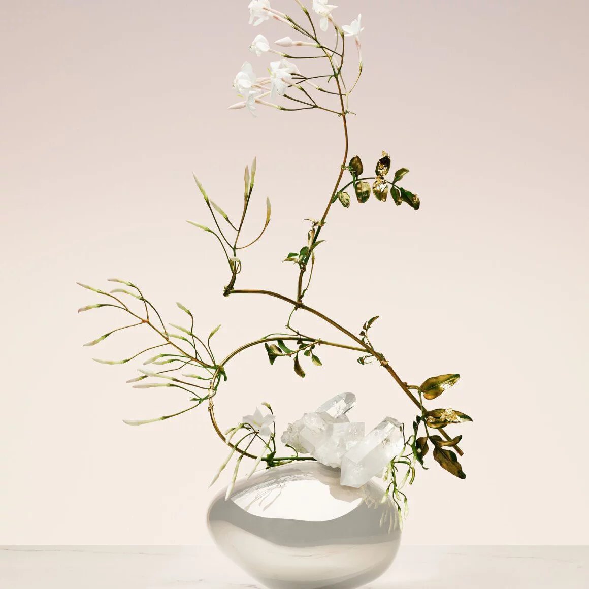Armani/Prive Blanc Kogane: artistic ikebana arrangement with delicate white florals, evoking purity and elevated craftsmanship.