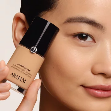 model with luminous silk foundation