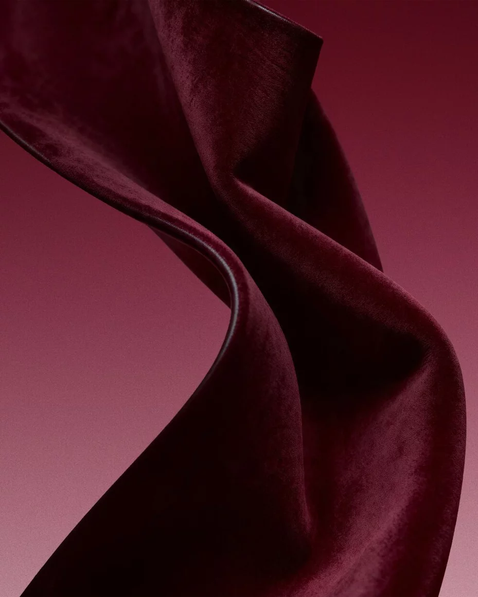 Burgundy fabric texture inspired by the sensual leather accord.