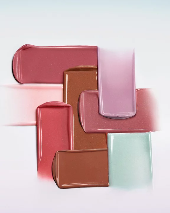 Armani Prisma Flash lipstick swatch in mauve, displayed with the iconic GA logo embossed in creamy, glossy color.