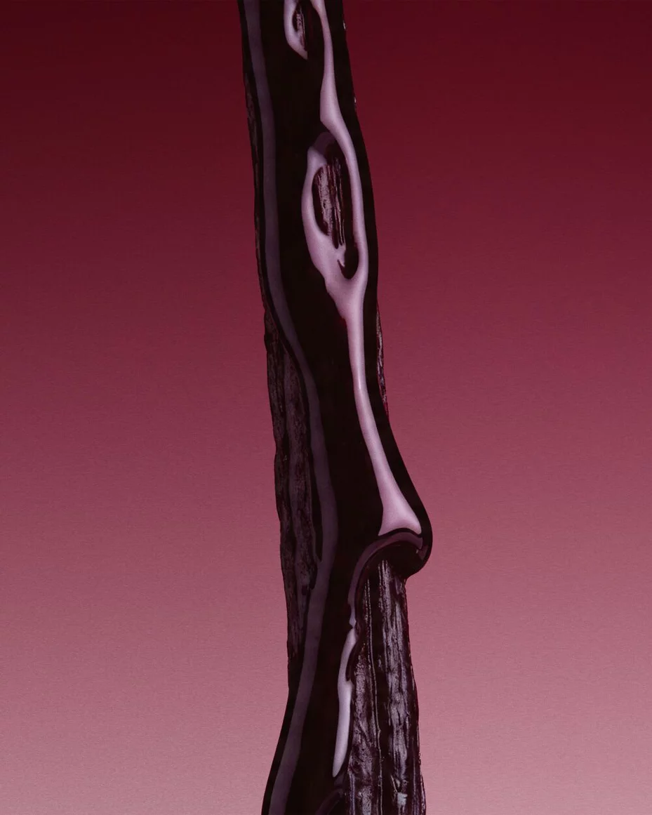 Dark licorice visual evoking the woody addiction of Cuir Rubis.