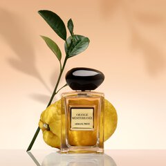 Bottle of ARMANI/PRIVE ORANGE MEDITERRANEE on a peach colored background