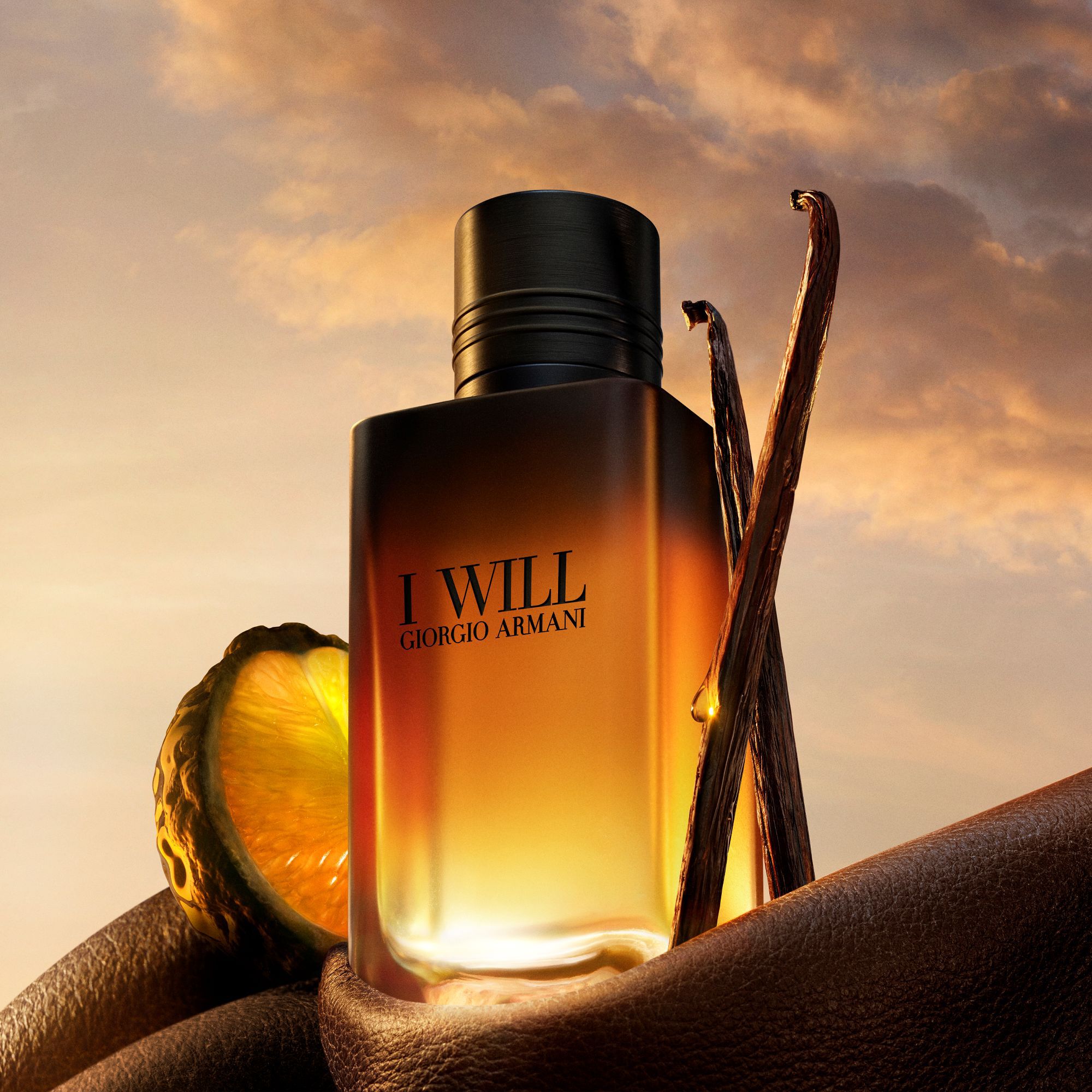 Giorgio Armani I Will Eau de Parfum bottle for men with orange slice, vanilla beans, and leather accents.