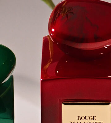 Display of Armani/Prive Les Terres Precieuses collection movie with different fragrances and ingredients in a cinematic setting.