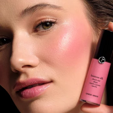 model with luminous silk highlighter