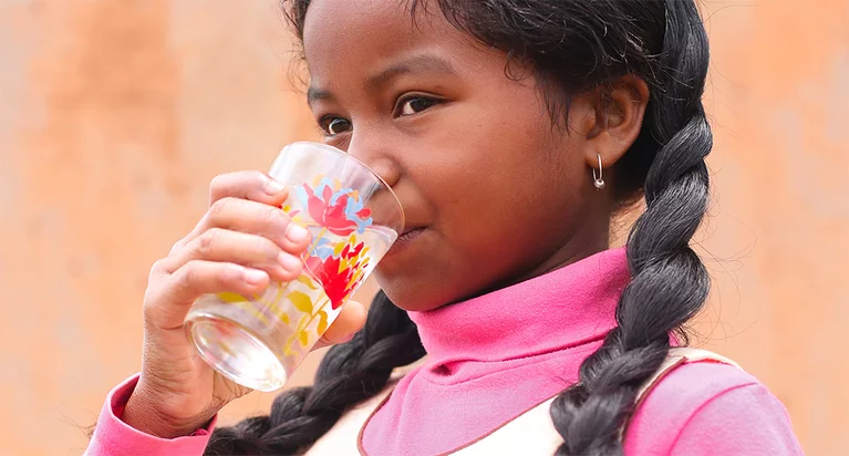 child drinking potable water