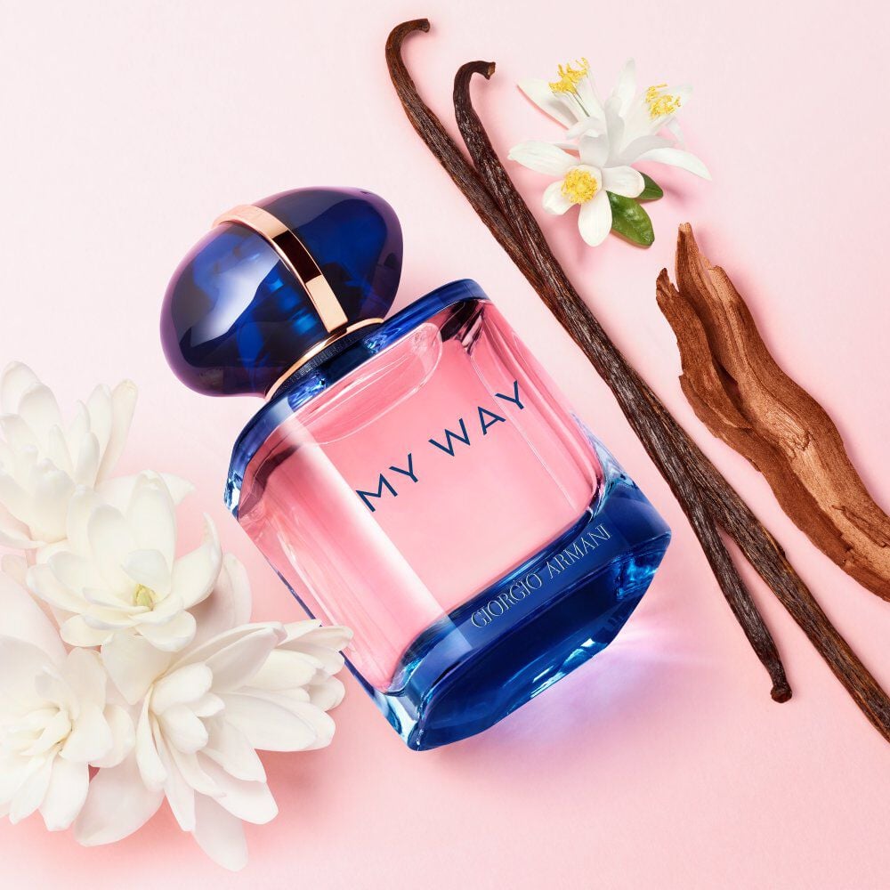 A bottle of My Way Eau de Parfum Nectar by Armani beauty accompanied by pear, bergamot, orange wedges and vanilla bean